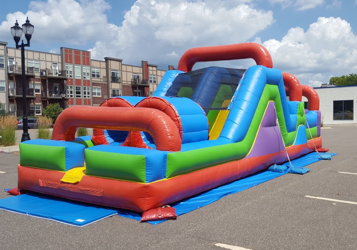 This inflatable is setup on asphalt and safely secured to the ground with sandbags